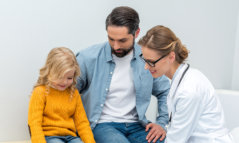 caregiver with a father and daughter