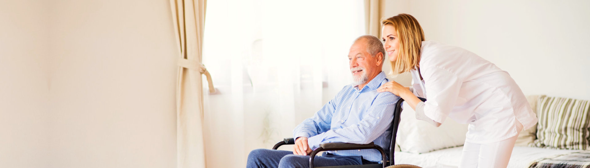 caregiver assisting a senior man