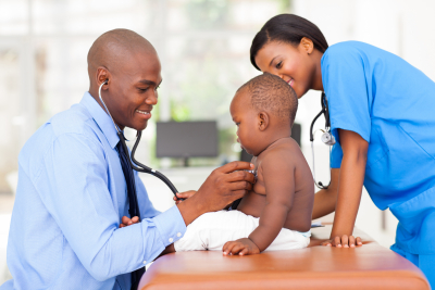 Doctor and nurse caring a baby